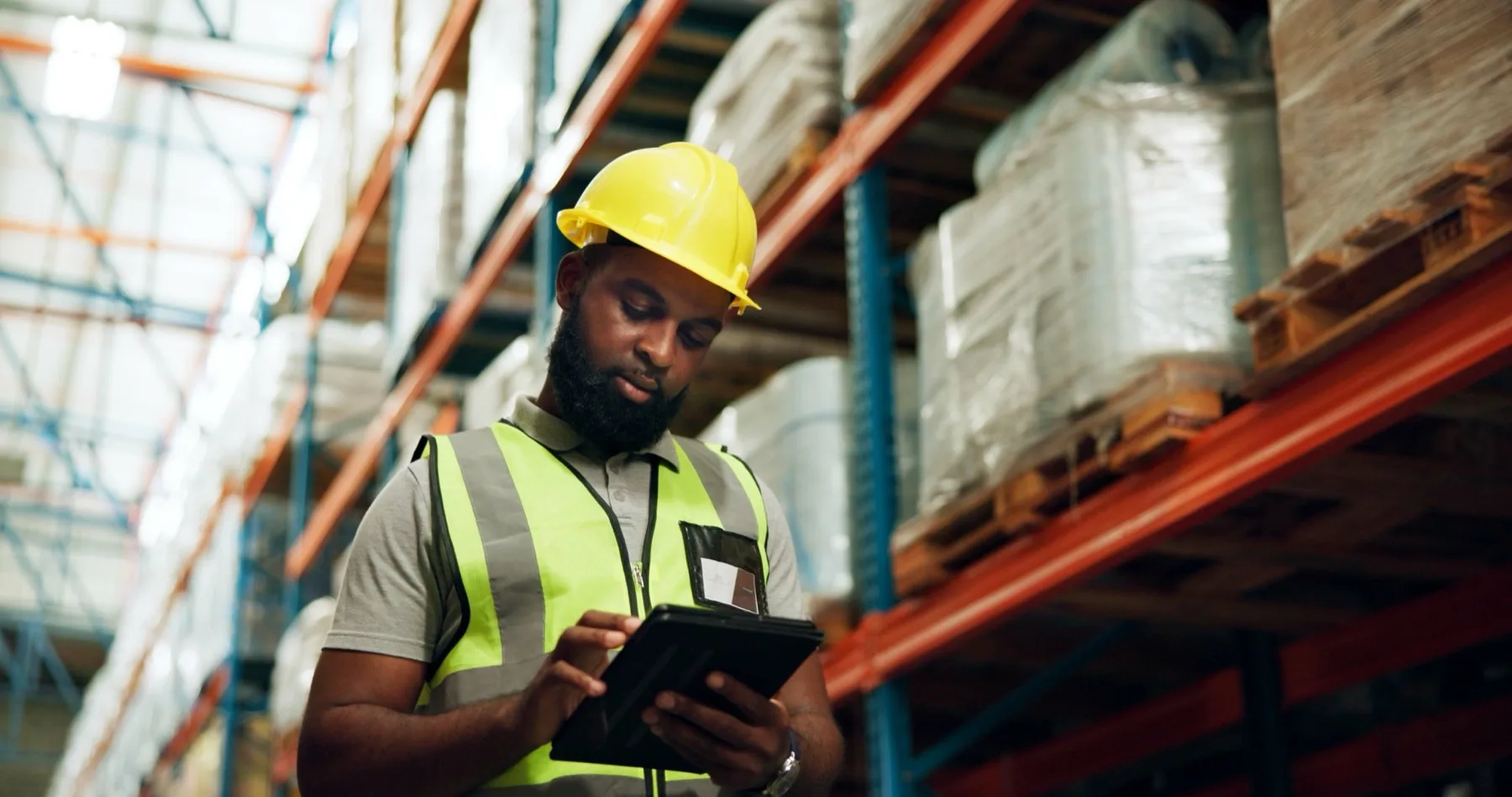 Warehouse worker checking stock and inventory in a commercial facility